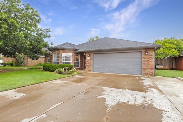 view of front of house with a garage and a front lawn