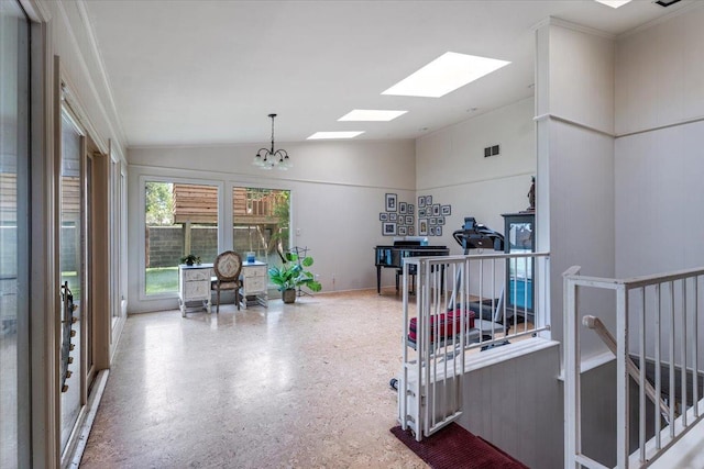 interior space with lofted ceiling and an inviting chandelier