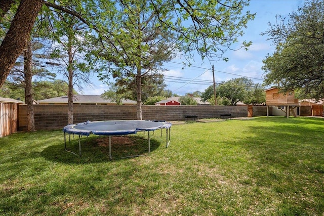 view of yard with a trampoline