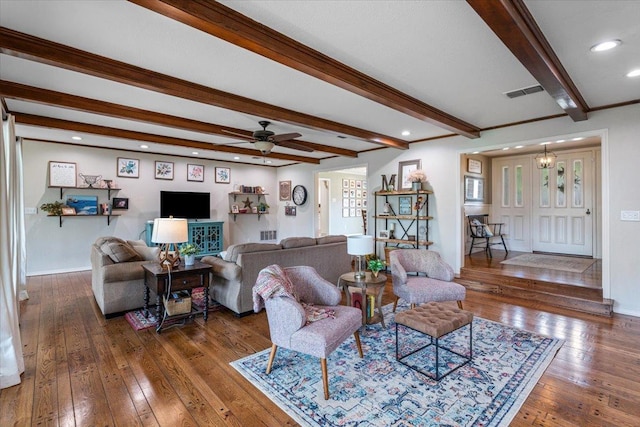 living room with beamed ceiling, dark wood-type flooring, and ceiling fan