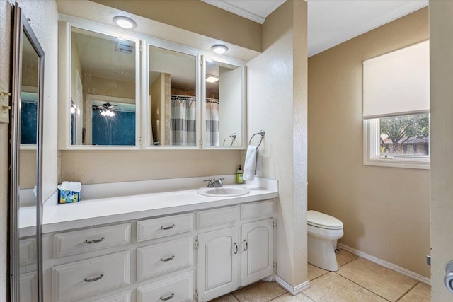 bathroom with vanity, tile patterned floors, and toilet