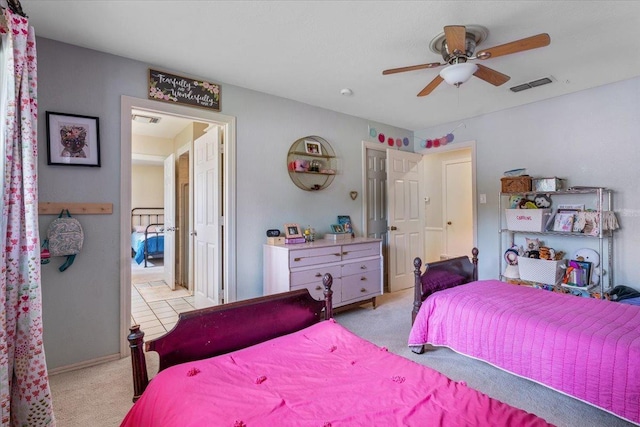 bedroom with light carpet and ceiling fan