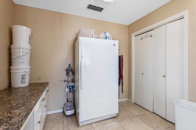 interior space with light tile patterned floors