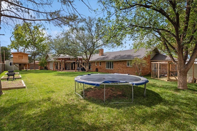 view of yard featuring a trampoline