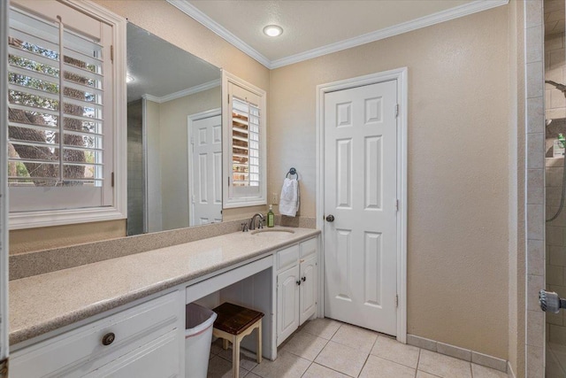 bathroom with ornamental molding, walk in shower, tile patterned floors, and vanity