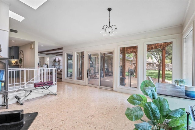 sunroom with a notable chandelier