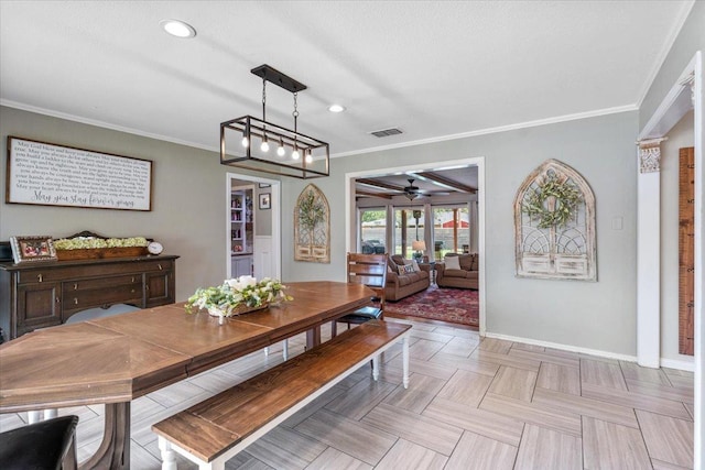 dining room featuring ceiling fan, ornamental molding, and light parquet flooring