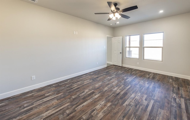 empty room featuring dark hardwood / wood-style floors and ceiling fan