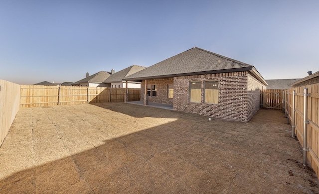 back of property featuring a patio area