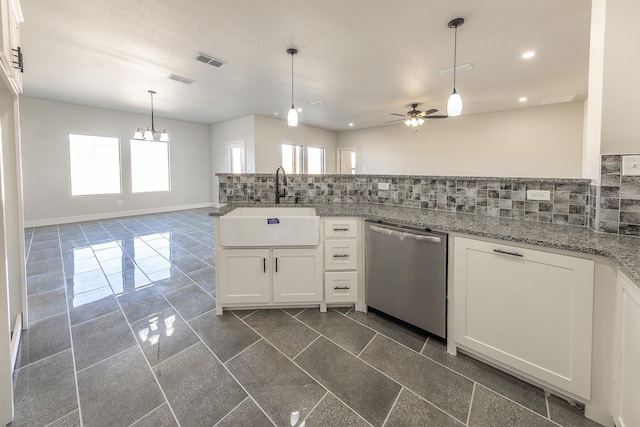 kitchen with decorative light fixtures, tasteful backsplash, white cabinetry, dishwasher, and sink