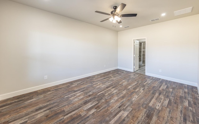 unfurnished room with dark wood-type flooring and ceiling fan