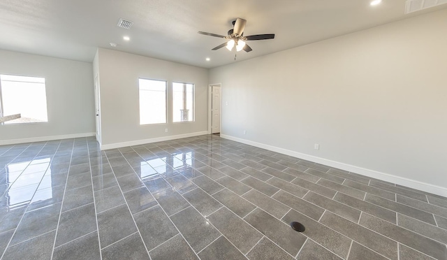 unfurnished room featuring ceiling fan