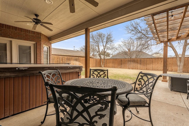 10801 Richmond Ave, Lubbock, TX 79424 - view of patio / terrace with a fenced backyard, a ceiling fan, outdoor dining area, and a hot tub