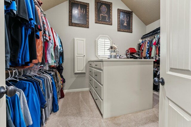 10801 Richmond Ave, Lubbock, TX 79424 - walk in closet with carpet flooring and lofted ceiling