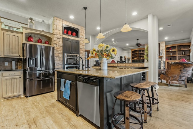 10801 Richmond Ave, Lubbock, TX 79424 - kitchen with light wood-style flooring, a sink, stainless steel appliances, and ceiling fan