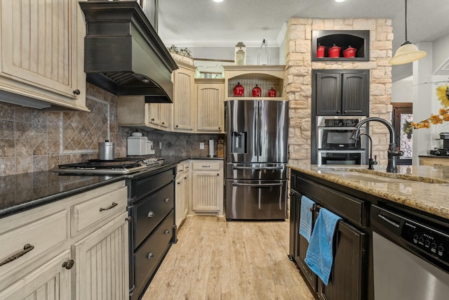 10801 Richmond Ave, Lubbock, TX 79424 - kitchen featuring stainless steel appliances, backsplash, a sink, light wood-style flooring, and custom exhaust hood