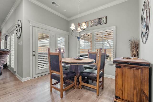 10801 Richmond Ave, Lubbock, TX 79424 - dining area with a healthy amount of sunlight, ornamental molding, a chandelier, light wood finished floors, and visible vents