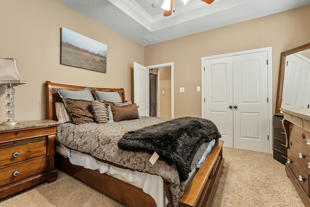 10801 Richmond Ave, Lubbock, TX 79424 - bedroom featuring a ceiling fan, light carpet, a tray ceiling, and a closet