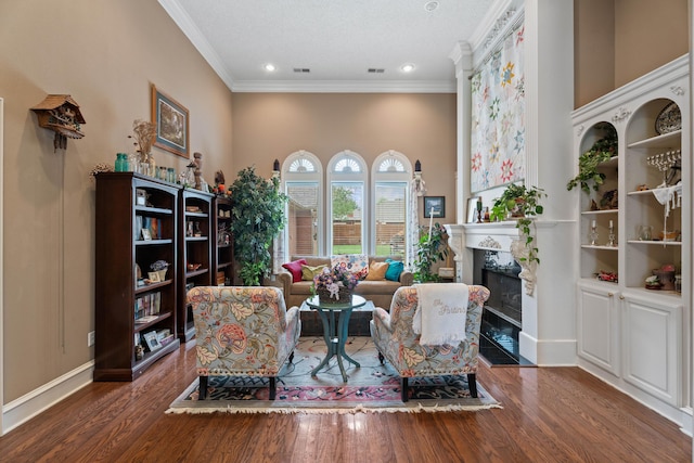 5401 County Rd 1420, Lubbock, TX 79407 - living room featuring ornamental molding, wood finished floors, a fireplace with flush hearth, and recessed lighting