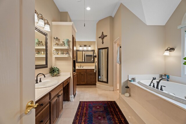 5401 County Rd 1420, Lubbock, TX 79407 - bathroom with a garden tub, two vanities, and tile patterned floors