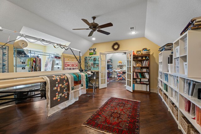 5401 County Rd 1420, Lubbock, TX 79407 - bedroom with vaulted ceiling, wood finished floors, a textured ceiling, and a ceiling fan