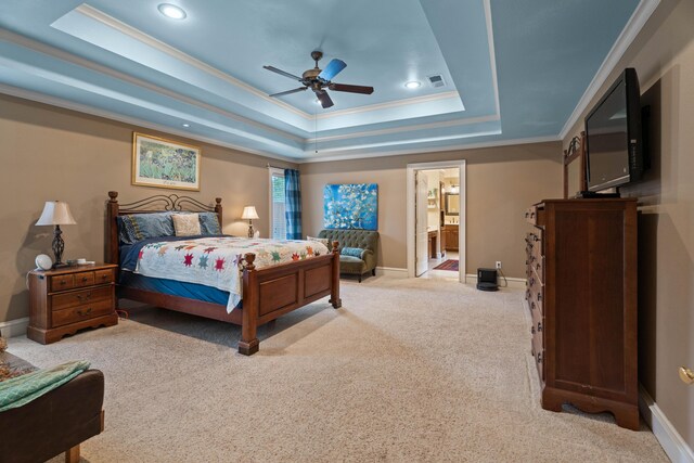 5401 County Rd 1420, Lubbock, TX 79407 - carpeted bedroom with a tray ceiling, ornamental molding, recessed lighting, connected bathroom, and a ceiling fan