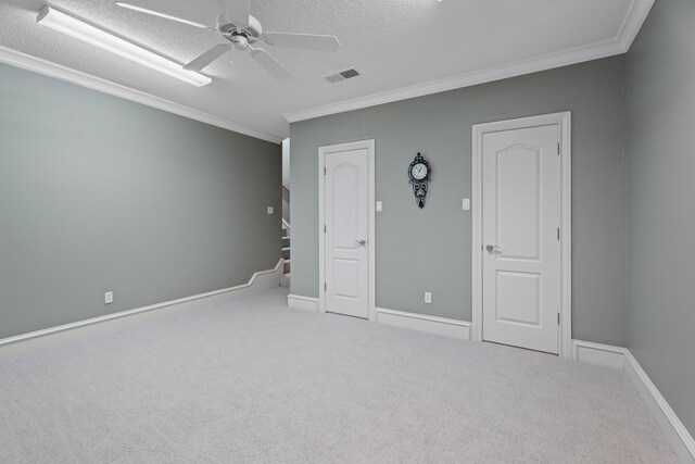 5401 County Rd 1420, Lubbock, TX 79407 - carpeted spare room with ornamental molding, a ceiling fan, a textured ceiling, and stairs