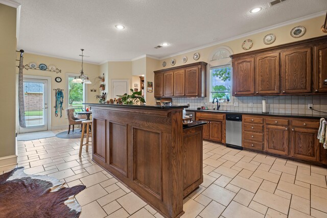 5401 County Rd 1420, Lubbock, TX 79407 - kitchen with dark countertops, decorative backsplash, a kitchen island, pendant lighting, and recessed lighting