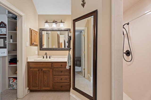 5401 County Rd 1420, Lubbock, TX 79407 - bathroom featuring vanity, tile patterned floors, and a shower
