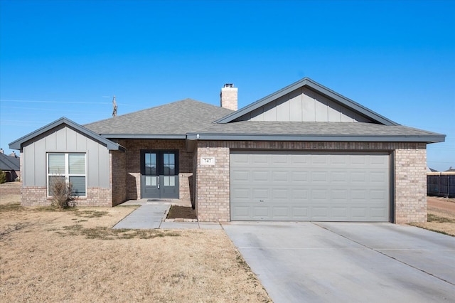 single story home with french doors and a garage