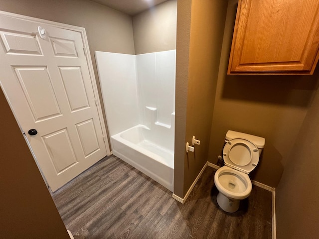 bathroom featuring wood-type flooring and toilet