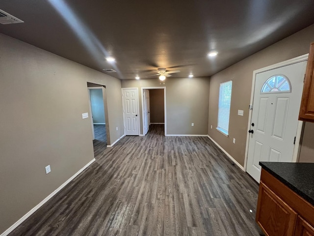 entryway with ceiling fan and dark hardwood / wood-style flooring