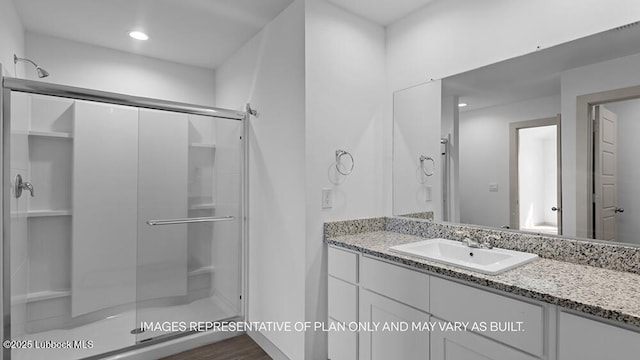 7816 93rd St, Lubbock, TX 79424 - bathroom featuring a stall shower, vanity, and recessed lighting