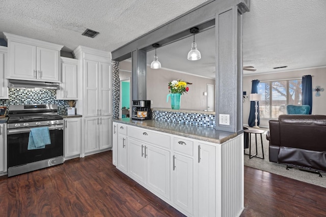 kitchen with white cabinetry, crown molding, stainless steel gas range, and dark wood-type flooring