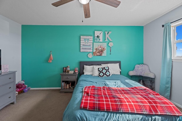 carpeted bedroom featuring a textured ceiling and ceiling fan