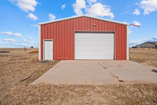 garage featuring a rural view