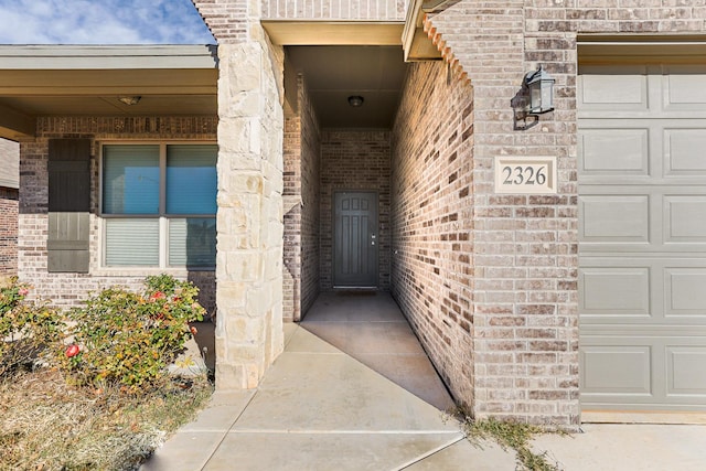 view of exterior entry featuring a garage