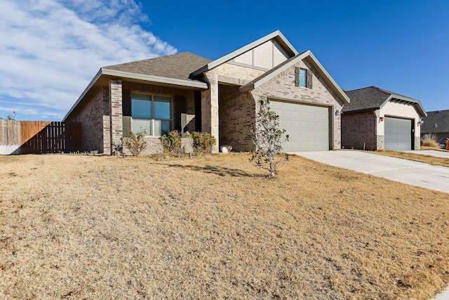 view of front of home with a garage and a front yard