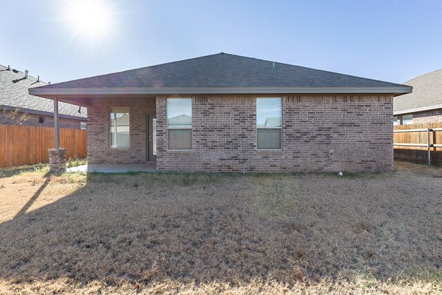 rear view of property featuring a patio