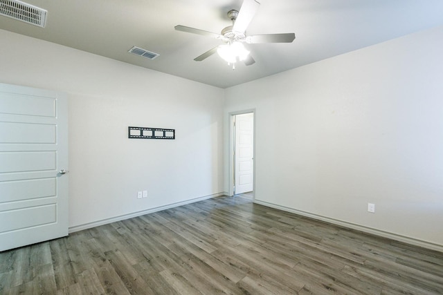 unfurnished room with ceiling fan and hardwood / wood-style floors