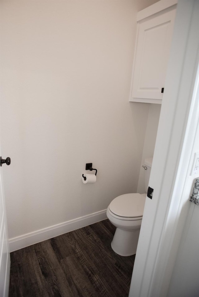 bathroom with wood-type flooring and toilet