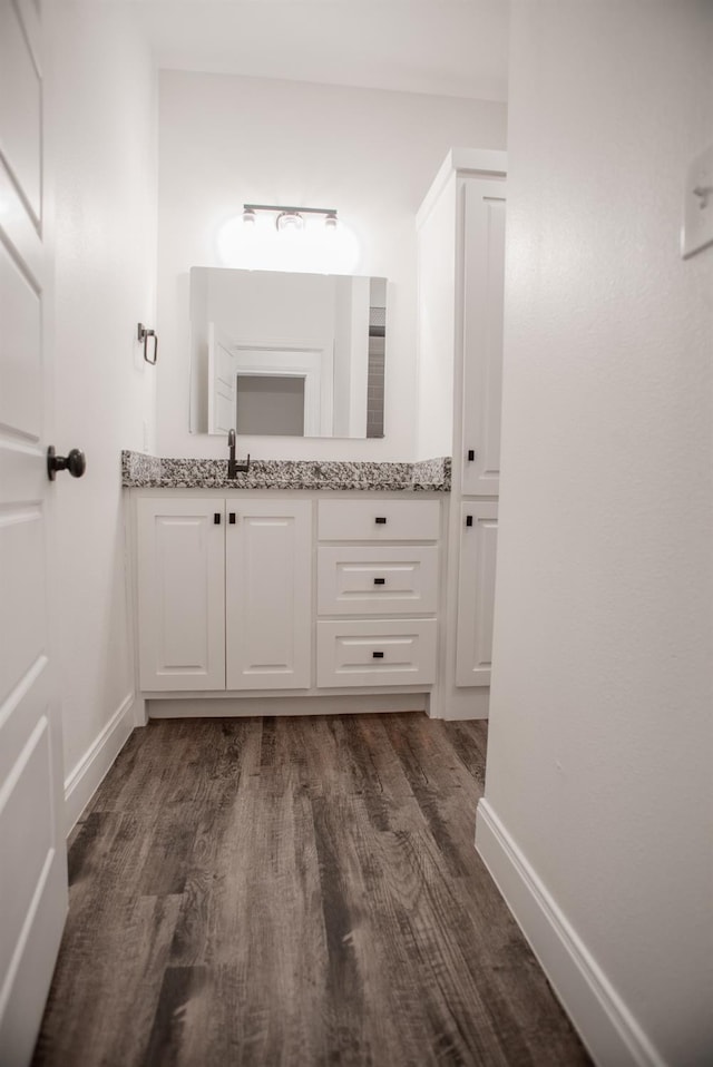 bathroom with vanity and hardwood / wood-style floors