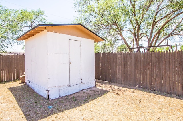 view of shed with fence