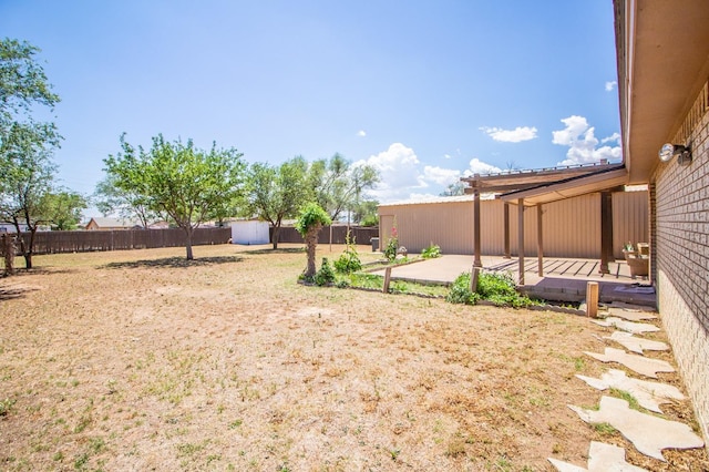 view of yard with a patio and a fenced backyard