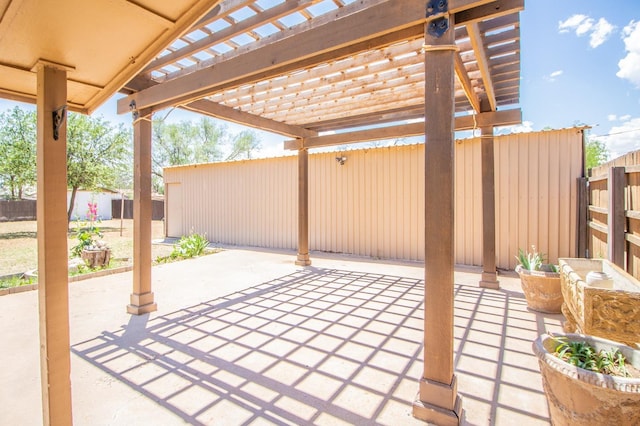 view of patio / terrace featuring fence and a pergola