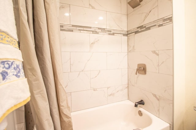 bathroom featuring shower / bathtub combination with curtain