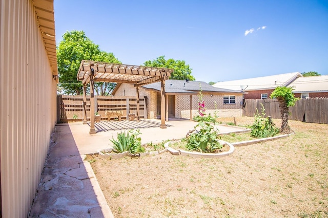 rear view of house with a patio, a fenced backyard, a pergola, and roof mounted solar panels