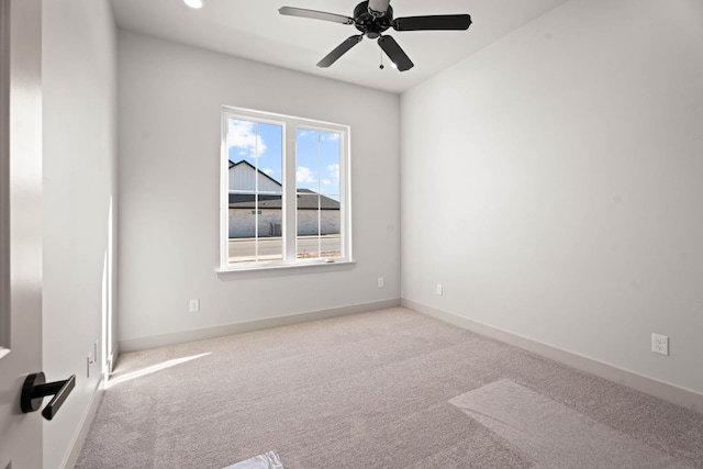 empty room with light carpet and ceiling fan