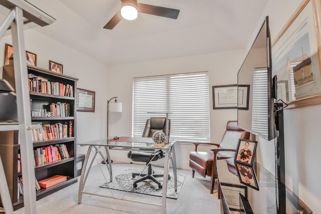 carpeted office with ceiling fan