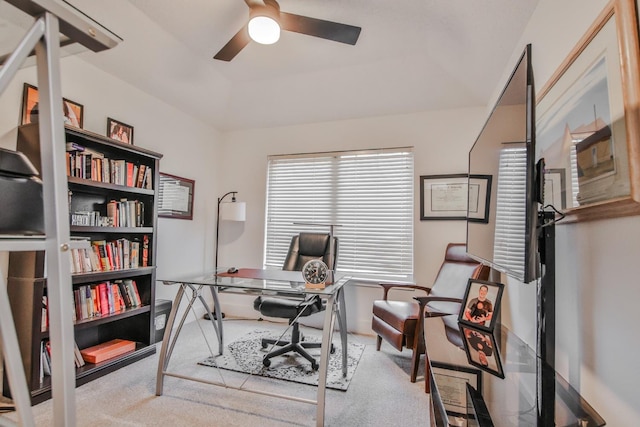 carpeted office featuring ceiling fan